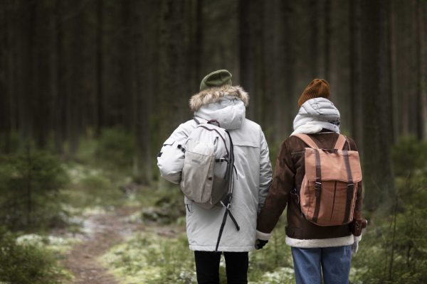 young-man-and-woman-in-forest-together-during-winter-road-trip (1) (2)-compressed